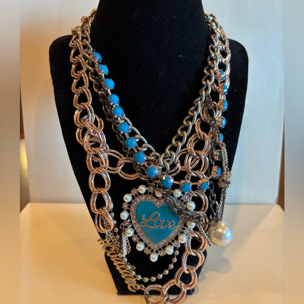 Juicy Couture necklace multiple layers and silver , gold, and turquoise.